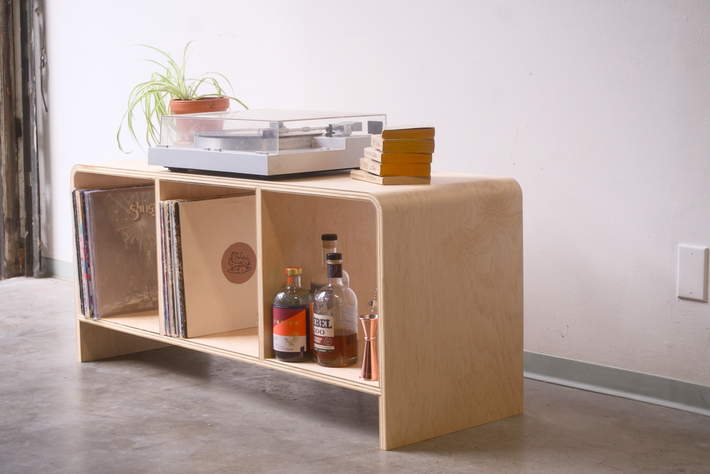 Maple Kerf Bent Record Console  made out of plywood, to house vinyl storage, bottles, and books.