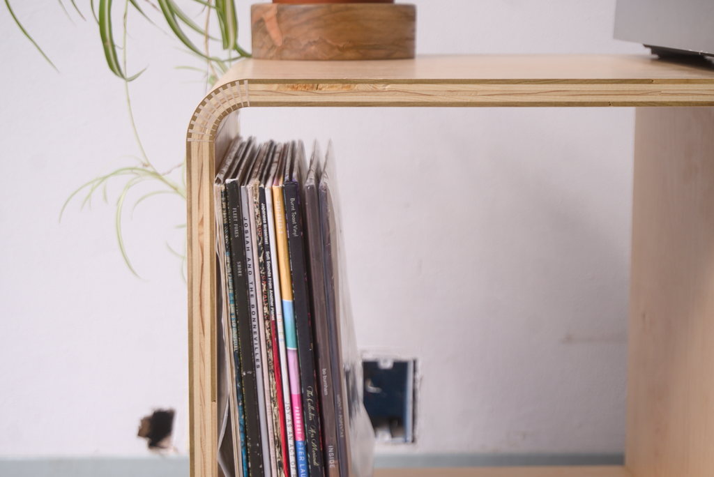 Maple Kerf Bent Record Console made out of plywood, to house vinyl storage, bottles, and books.