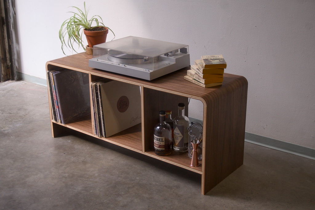 Walnut Kerf Bent Record Console made out of plywood, to house vinyl storage, bottles, and books.