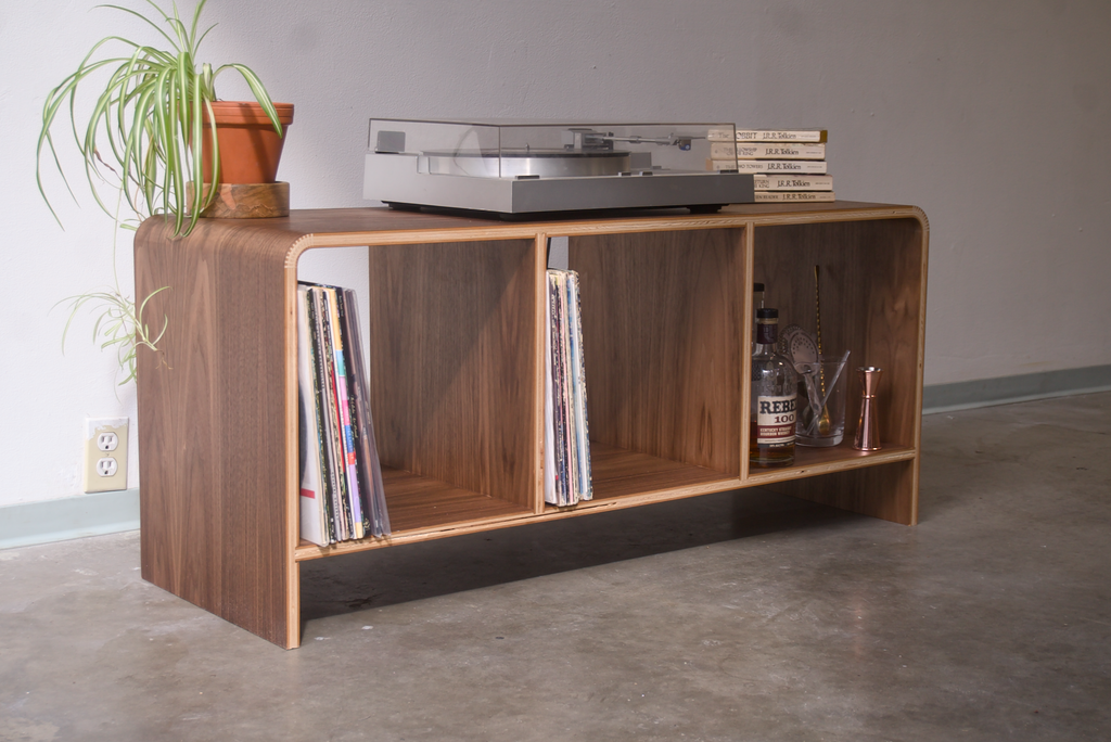Walnut Kerf Bent Record Console  made out of plywood, to house vinyl storage, bottles, and books.